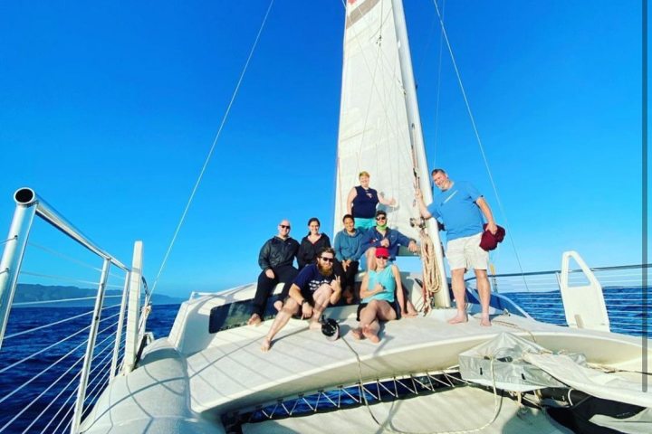 a group of people riding on the back of a boat