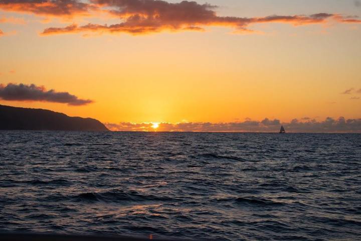 a sunset over a body of water